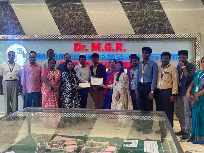 A DURO internship certificate being presented at Dr. M.G.R. Educational and Research Institute