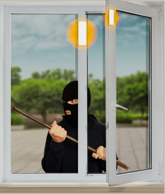 An intruder forcing a window open while the sensors on the frame light up