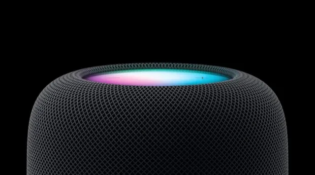 Apple HomePod with the Siri light glowing on top